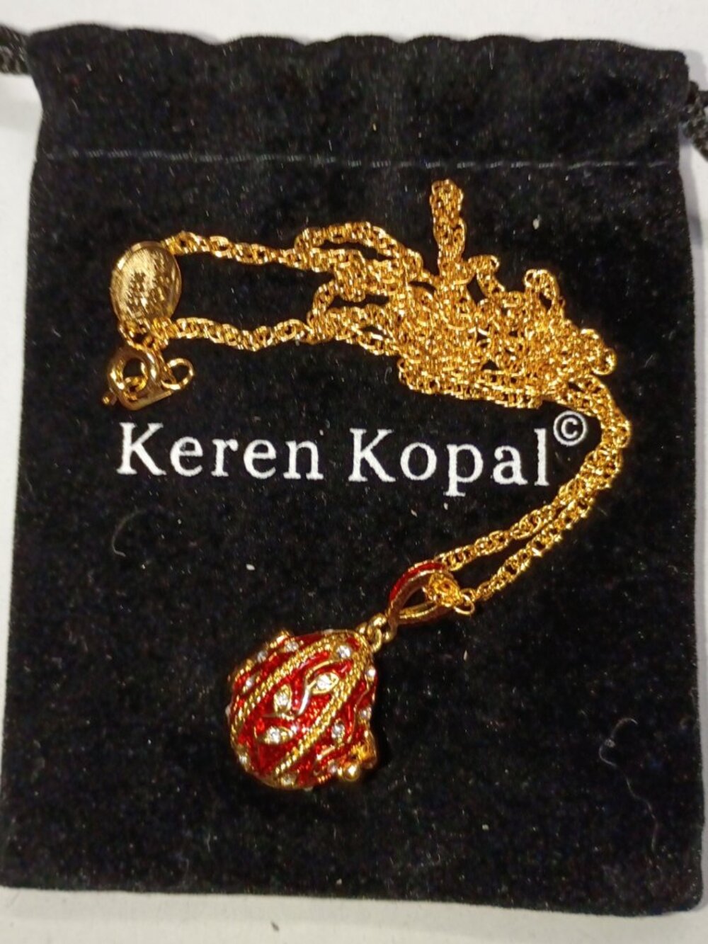 Keren Kopal Gold-Plated Red Egg with Angel-Charm Locket Necklace with Crystals